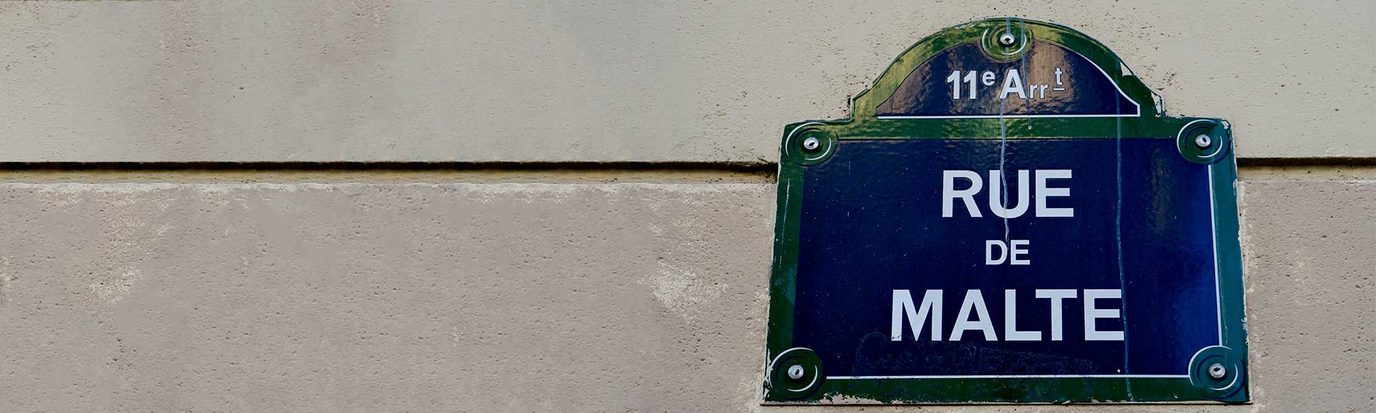 A street sign on a wall