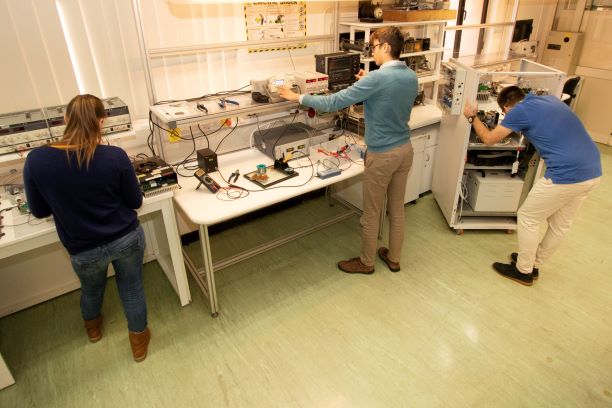 Three people working in the Power Lab