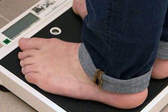A person on scales to check the weight