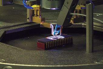 A machine in the process of making a microchip