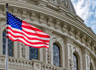 US flag in front of a building