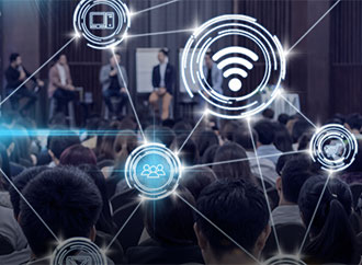 Speakers on stage and audience