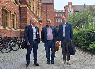 Three academics at a foreign University