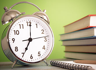 clock and books