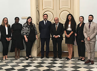 Group photo - MA Conflict Resolution and Mediterranean Security students and Dr Omar Grech with HE Dr George Vella