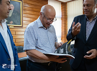 Faculty of ICT Dean and Deputy Dean present Rector with Chat with FICT Exhibition Booklet 2023