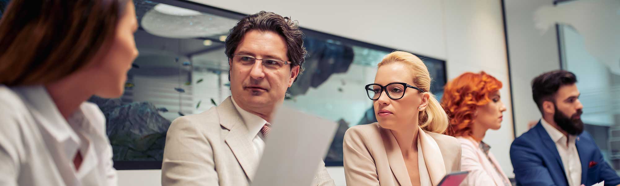 Five members of staff at a meeting