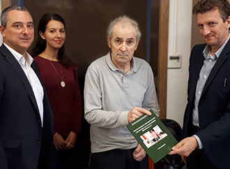 Group photo with Prof. Seychell presenting the publication
