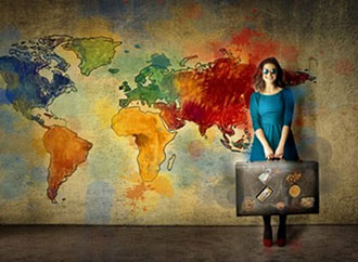 Girl with suitcase and the map of the word as a background image