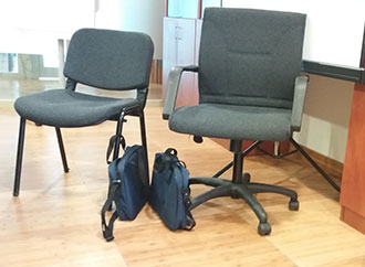 bags next to chairs