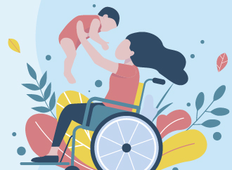 Parent in wheelchair holding a child