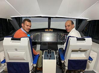 Pilot and Jason Gauci in cockpit; ACSAGO logo