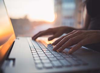 hands using a laptop