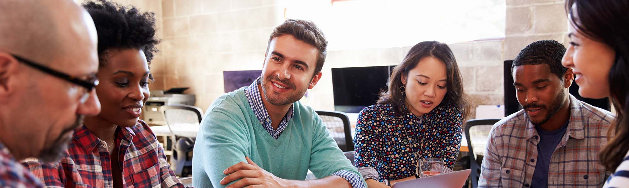 A group of multi-cultural people talking