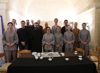 Participant at the buddhist christian evening