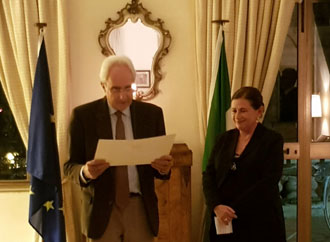 Professor Gloria Lauri-Lucente being given the Order of the star by the Italia Ambassador