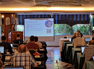 Audrey Zammit giving a presentation during an event