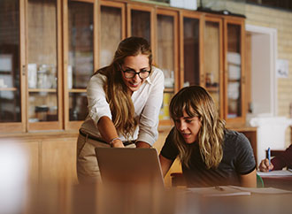 A classroom setting with lecturer and student