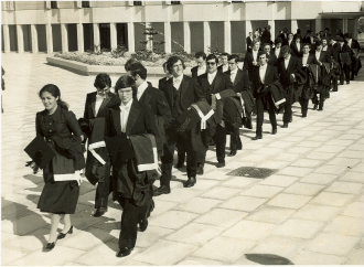 Procession of graduates (during the 1970s) on campus
