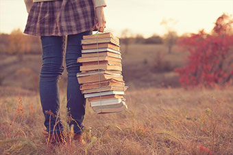 A person holding some books