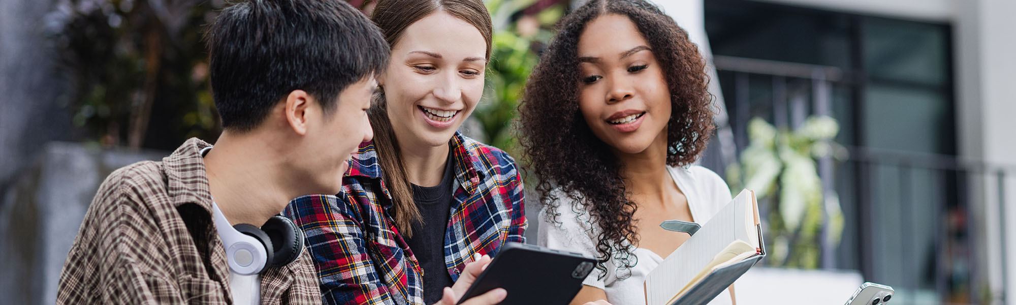 Three international students studying at the university campus