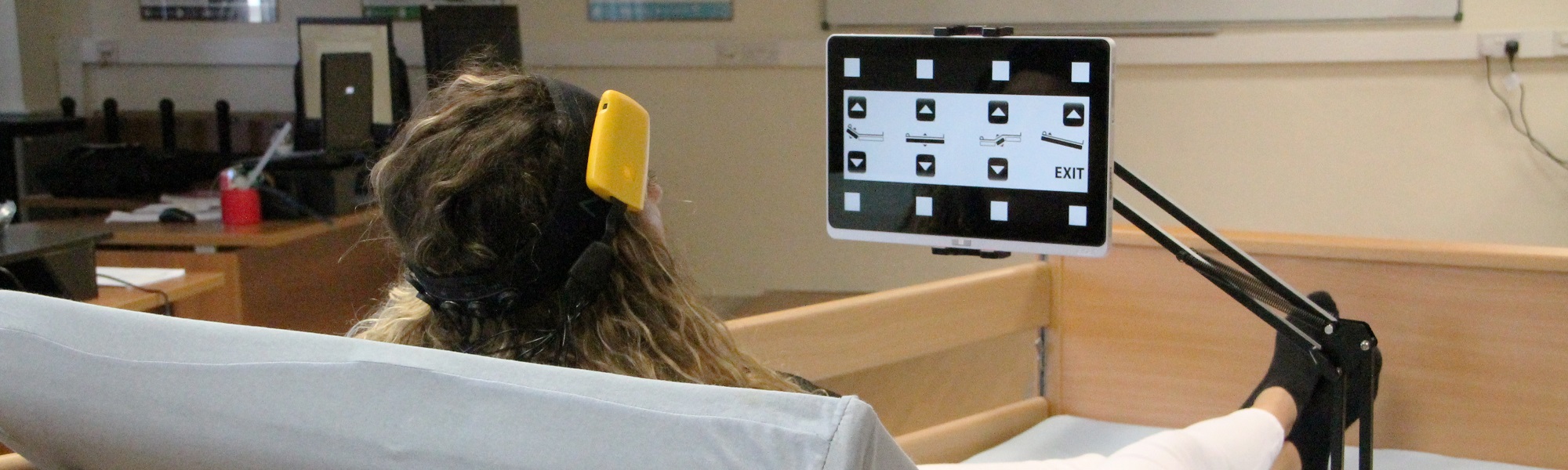 woman in bed controlling equipment using eeg