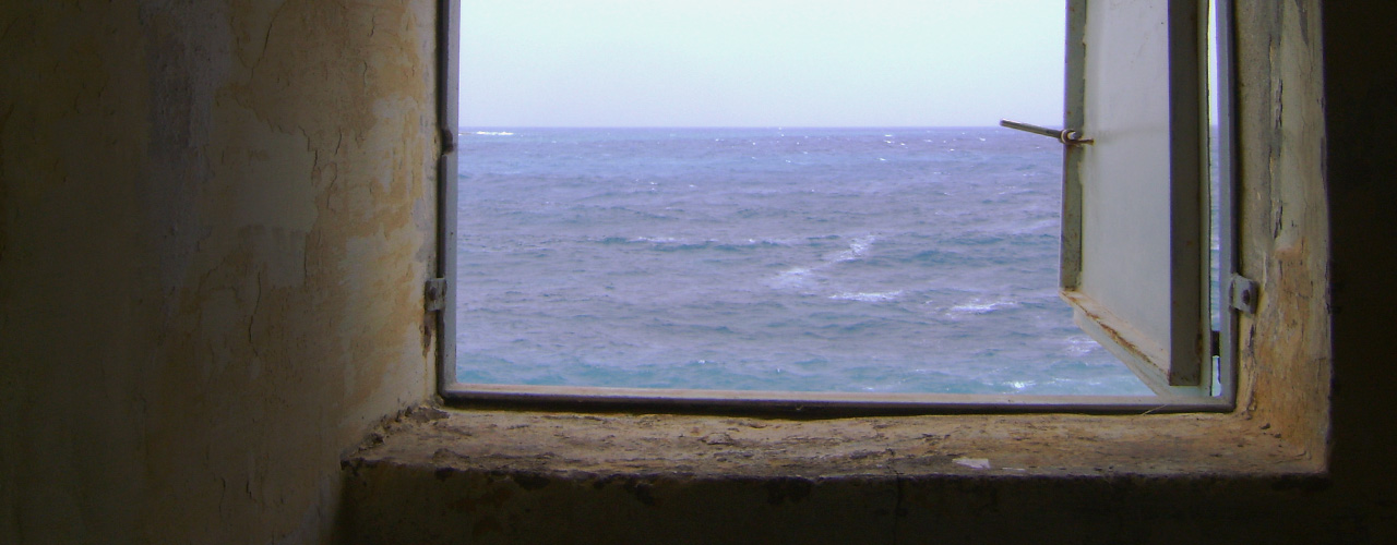 A window with a view of the sea