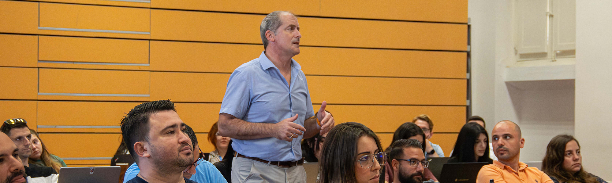 An academic giving a lecture to students