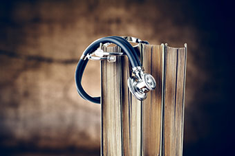 A stethoscope and some books