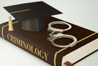 A graphic of a criminology book, a graduation cap and a pair of hand cuffs
