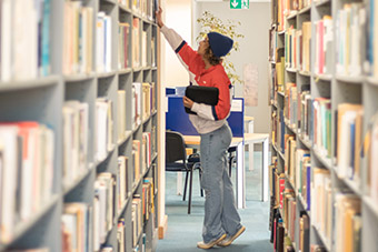 A student at the UM Library, Msida Campus