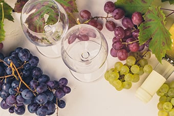 Wine composition on rustic background