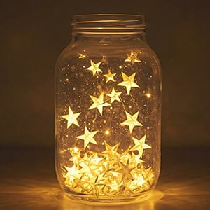 A jar filled with glowing stars