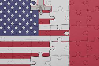 Puzzle with the colourful national flag of Malta and flag of United States of America, concept