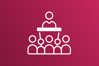 Icon representing a lecturer surrounded by students, on a dark pink backgound