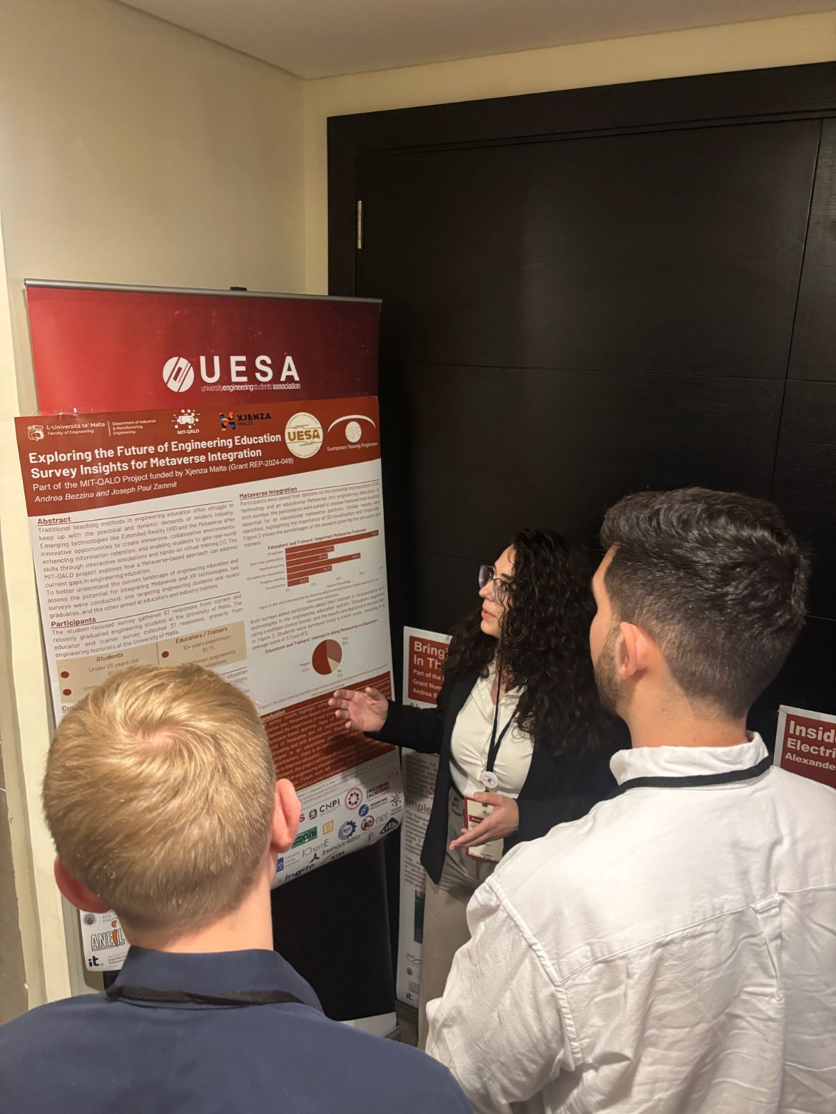 A Researcher presenting the MIT-QALO Poster