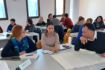 Academics discussing during a workshop in progress